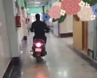 Negligence at CHC Chattergam: Employee Caught Riding Scooty in Hospital Corridors